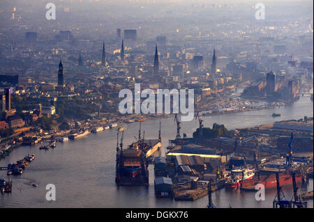 Blohm and Voss shipyard with floating docks in the Elbe River, in the morning, Hamburg, Hamburg, Germany Stock Photo