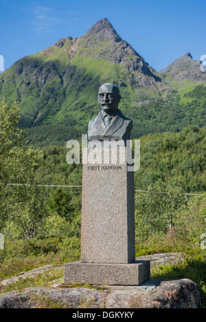 Monument for Knut Hamsun, bronze bust on a stone plinth, in front of a mountain landscape, Ortsteil Hamsund, Kommune Hamarøy Stock Photo