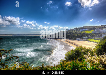 Porthminster beach St Ives Cornwall England with white waves and blue sea and sky on a beautiful summer day in vivid HDR Stock Photo