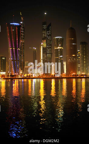 Night shot of the Doha skyline, Tornado Tower, Navigation Tower, Peace Towers, Al-Thani Tower, Doha, Qatar, Persian Gulf Stock Photo