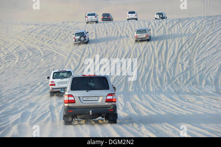 Convoy of SUVs, 4x4, sand dune, desert, Emirate of Qatar, Persian Gulf, Middle East, Asia Stock Photo