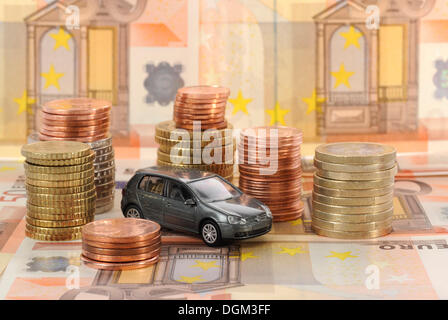 Banknotes, coins, euro, symbolic image for acquisition costs, maintenance of a car Stock Photo