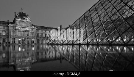 Black and white, night shot, Pavillon Richelieu, glass pyramid entrance, Palais du Louvre, Paris, France, Europe Stock Photo