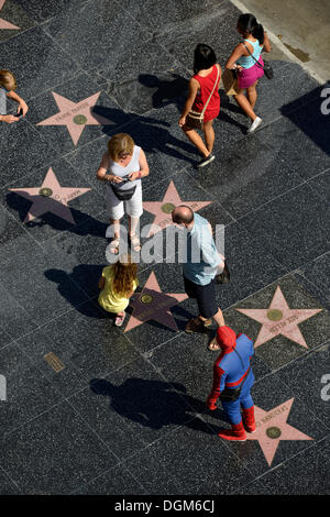 Tourists taking photographs in front of terrazzo star for Britney Spears, Walk of Fame, Hollywood Boulevard, Hollywood Stock Photo