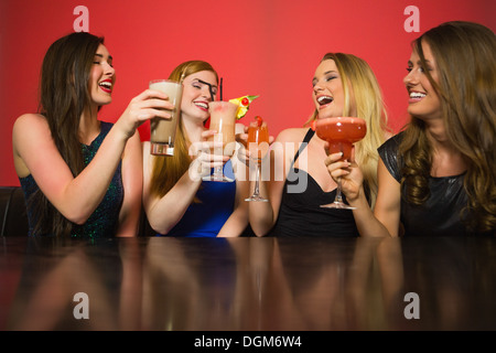 Happy friends clinking glasses Stock Photo