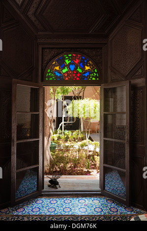 Beautiful handcrafted stained glass above doorway to Moroccan riad. Stock Photo
