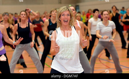 Young woman doing aerobics, Haus des Sports venue, Stuttgart, Baden-Württemberg, Germany Stock Photo