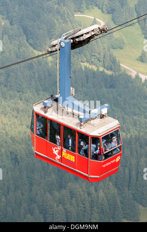 The Pilatus cable car ascends towards the the peak of Mount Pliatus, near Lake Lucerne, Switzerland. Stock Photo