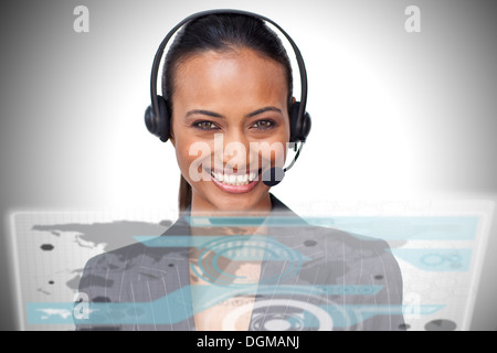 Pretty smiling businesswoman using futuristic interface hologram Stock Photo