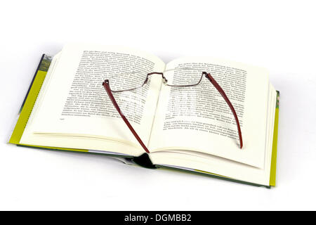 Reading glasses lying on a book Stock Photo