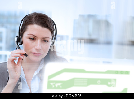 Content businesswoman looking at futuristic interface hologram Stock Photo