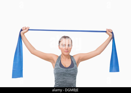 Young woman training using a resistance band Stock Photo