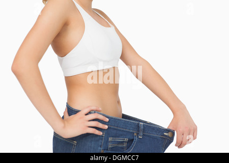 The belly of a slim woman close up. Female press. A drop of sweat on a thin  sports stomach Stock Photo - Alamy