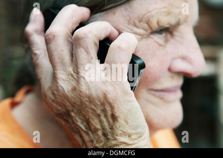 Elderly woman using a smartphone Stock Photo