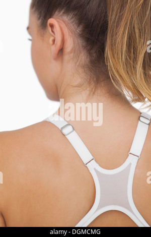 Rear view of young woman wearing a sports bra Stock Photo