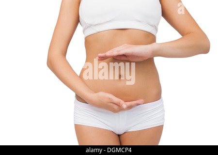 woman wearing sports bra and shorts drinking fruit juice Stock Photo - Alamy