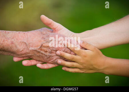 Three generations holding hands Stock Photo