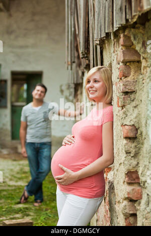 Two pregnant women hold their bellies, studio Stock Photo - Alamy