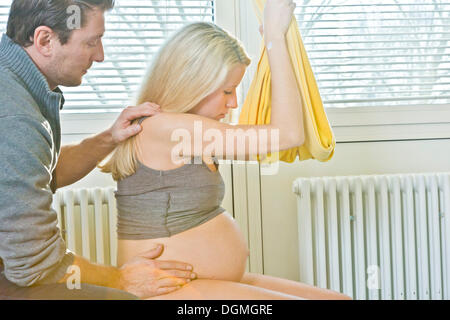 Man and woman in the delivery room during childbirth, Germany Stock Photo