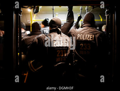 Riot police riding in public service vehicle of the Stuttgarter Strassenbahnen to a demonstration against Stuttgart 21 in Stock Photo