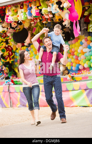 USA, Utah, Salt Lake City, Happy Family with son (4-5) in amusement park Stock Photo