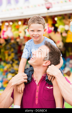USA, Utah, Salt Lake City, Happy father with son (4-5) in amusement park Stock Photo