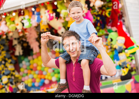 USA, Utah, Salt Lake City, Happy father with son (4-5) in amusement park Stock Photo