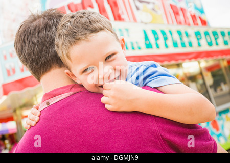 USA, Utah, Salt Lake City, Father and son (4-5) in amusement park Stock Photo