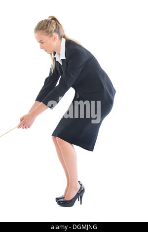 Concentrating young businesswoman pulling a rope Stock Photo