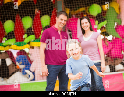 USA, Utah, Salt Lake City, Happy Family and son (4-5) having fun in amusement park Stock Photo
