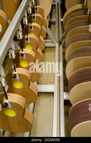Row of guitar bodies during production process at Martin guitars factory  in Nazareth, Pennsylvania, USA Stock Photo