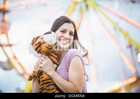 USA, Utah, Salt Lake City, Portrait of woman with toy tiger Stock Photo