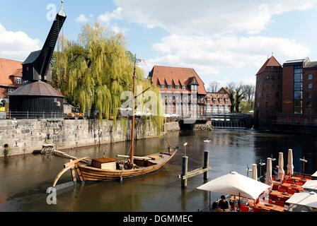 Historical salt port at the Ilmenau river, replica of a salt ship, old crane, old town, Lueneburg, Lower Saxony Stock Photo