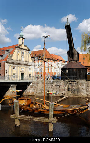 Historical salt port at the Ilmenau river, replica of a salt ship, old crane, old town, Lueneburg, Lower Saxony Stock Photo