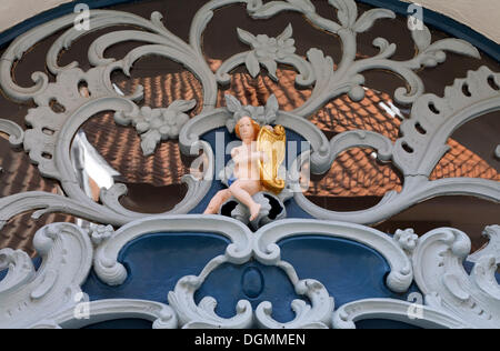 Small cherub playing harp, skylight, detail of a baroque door, old town, Lueneburg, Lower Saxony Stock Photo