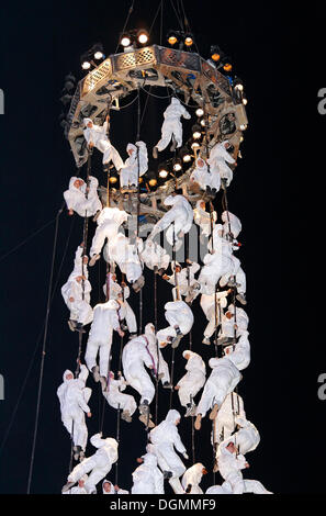 White-clad trapeze artists hanging from ropes, Global Rheingold, open-air theater by La Fura dels Baus, Duisburg-Ruhrort Stock Photo