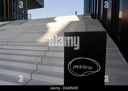Sign showing the way to the Pebbles Bar in front of a wide flight of stairs, Hafenspitze, Medienhafen harbour, Duesseldorf Stock Photo