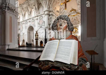 Life-size, carved figure holding an Evangelion, St. Kiliansdom cathedral, Wuerzburg, Lower Franconia, Bavaria Stock Photo