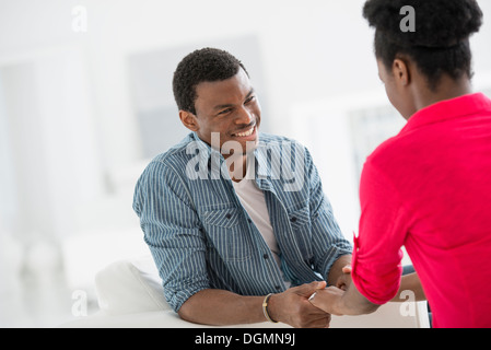 Office interior. Two people talking to each other, face to face. Stock Photo