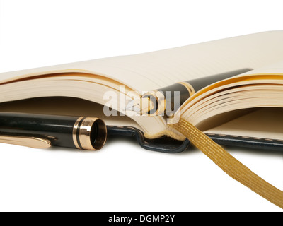 fountain pen and open diary book isolated on white background Stock Photo