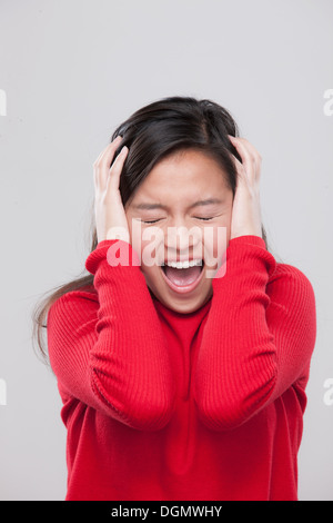 Portrait of teenage girl (16-17) in distress Stock Photo