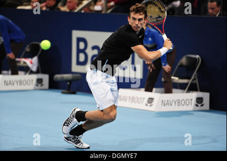 Basel, Switzerland. 23 Oct, 2013. Henri Laaksonen (SUI) swings for the ball during the 1st round of the Swiss Indoors at St. Jakobshalle on Wednesday. Photo: Miroslav Dakov/Alamy Live News Stock Photo