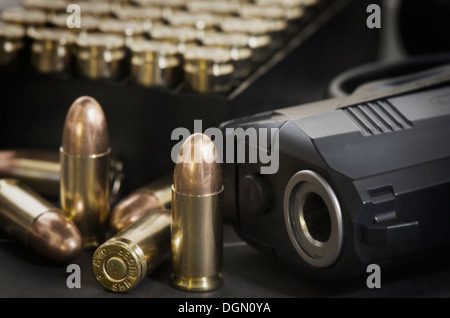 Beretta 9mm PX4 Storm semi-automatic pistol with magazine and full metal jacket ammunition on background of shooting target Stock Photo