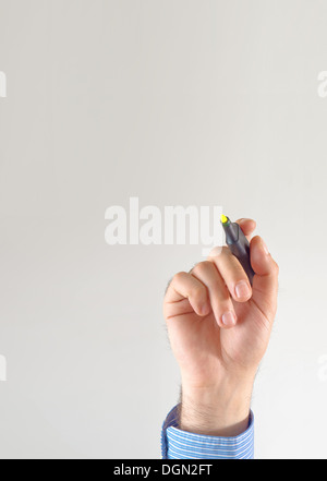 Businessman hand writing with yellow marker pen on the screen Stock Photo