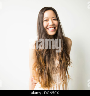 Portrait of woman with long brown hair Stock Photo