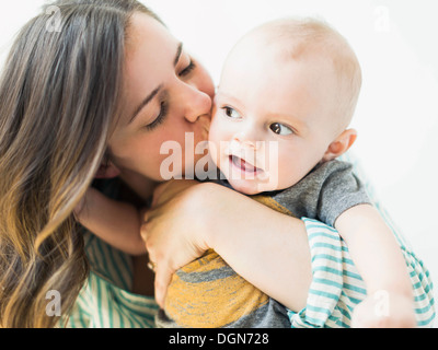 Studio portrait of mother holding baby boy (6-11 months) Stock Photo