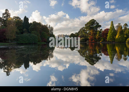 Beautiful autumn colours reflecting in a lake at Sheffield Park in East Sussex. Stock Photo