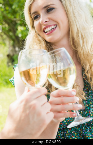 Blonde young woman toasting with her boyfriend Stock Photo