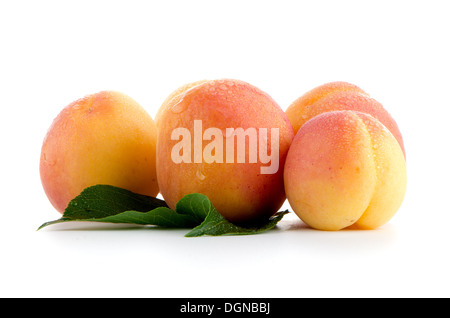 Sweet peaches with leafs on a white background Stock Photo