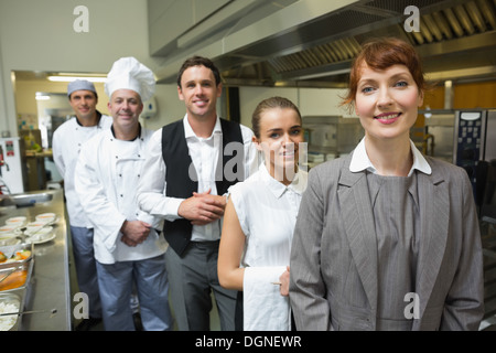 Nice female manager posing with the staff Stock Photo